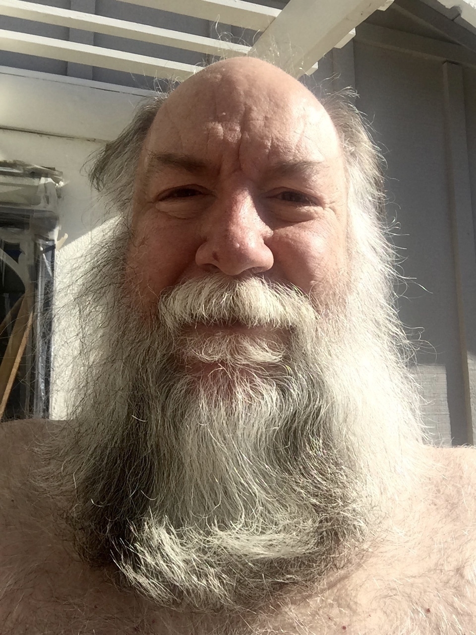 Self portrait with long beard and hair.