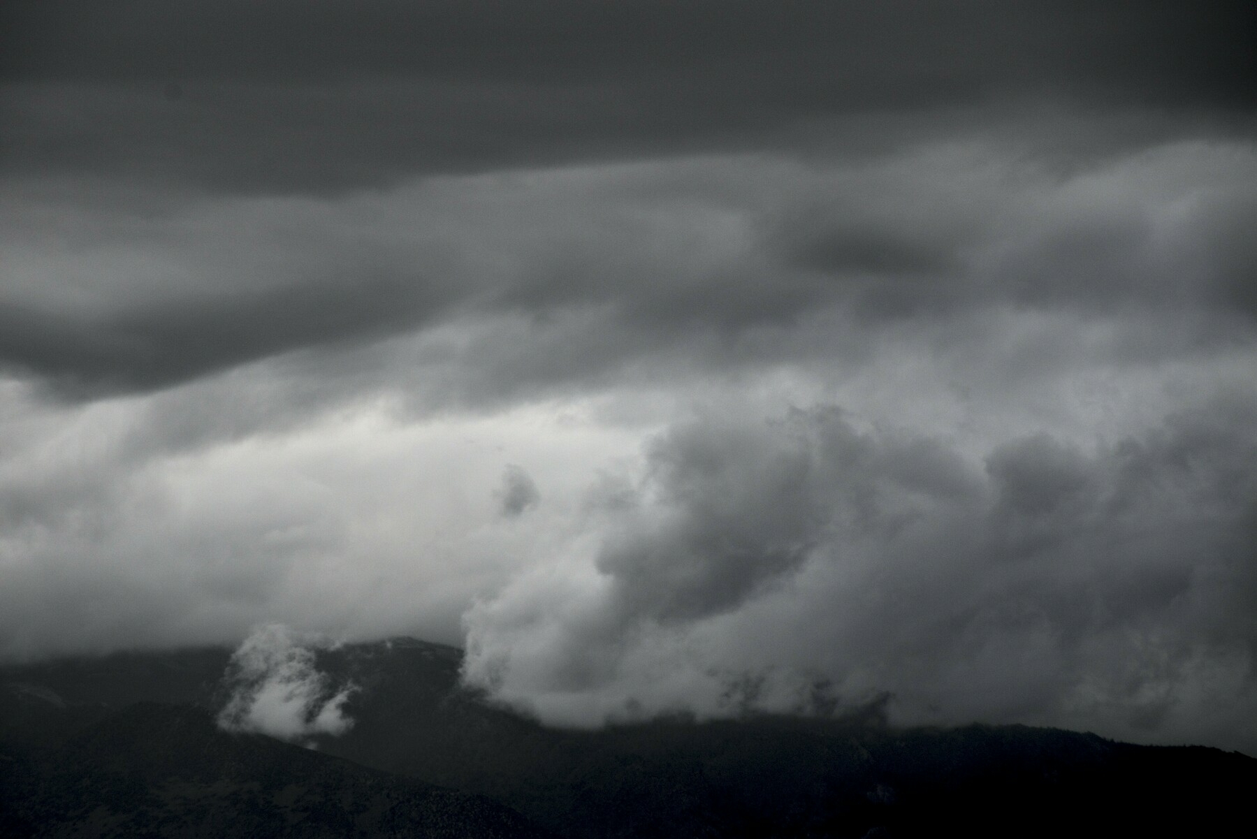 Grey clouds of varying lightness form interesting patterns.