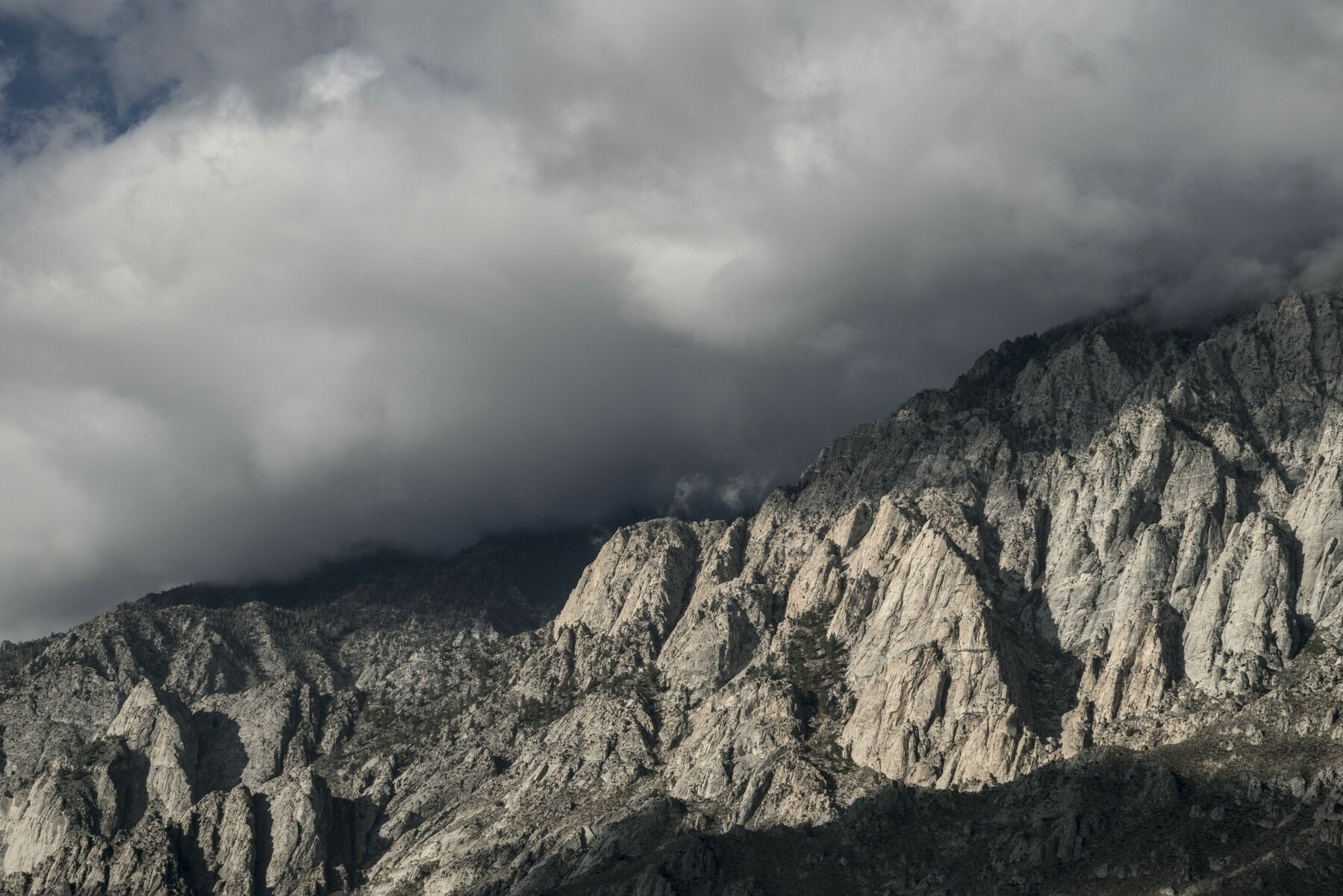 Rocky crags with a cloud cap.