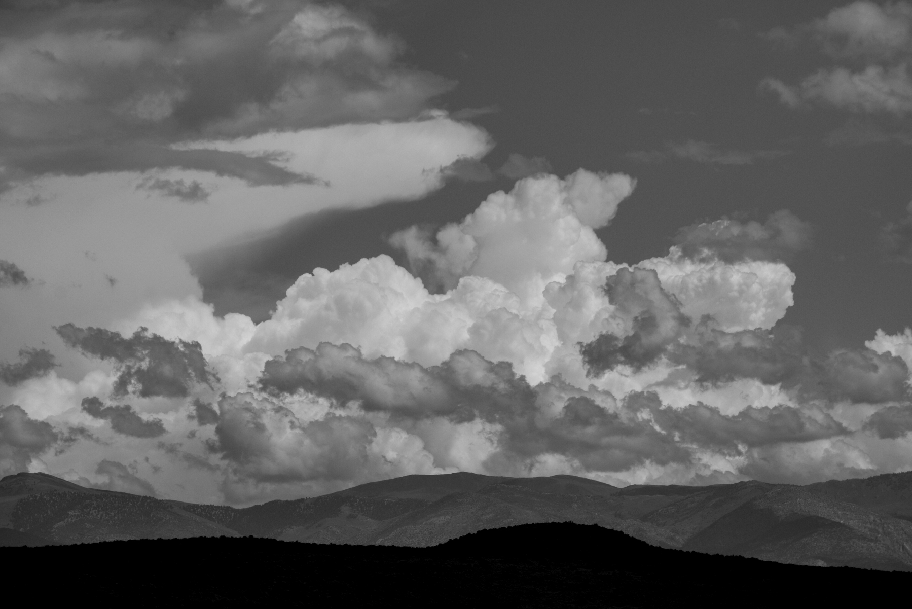 Cloudscape over the White Mountains in black and white.