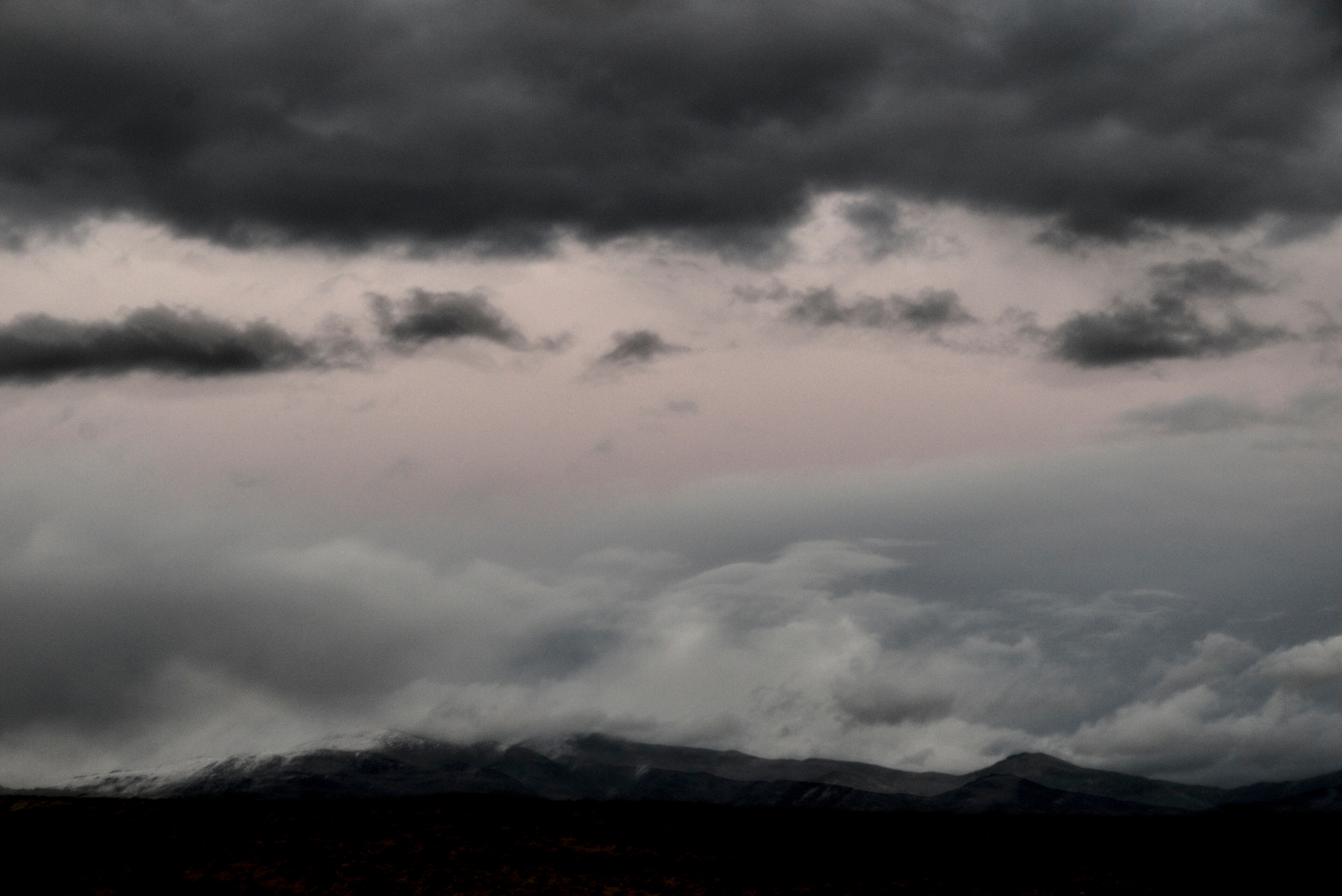 Grey, soft clouds, and soft pink sky. 